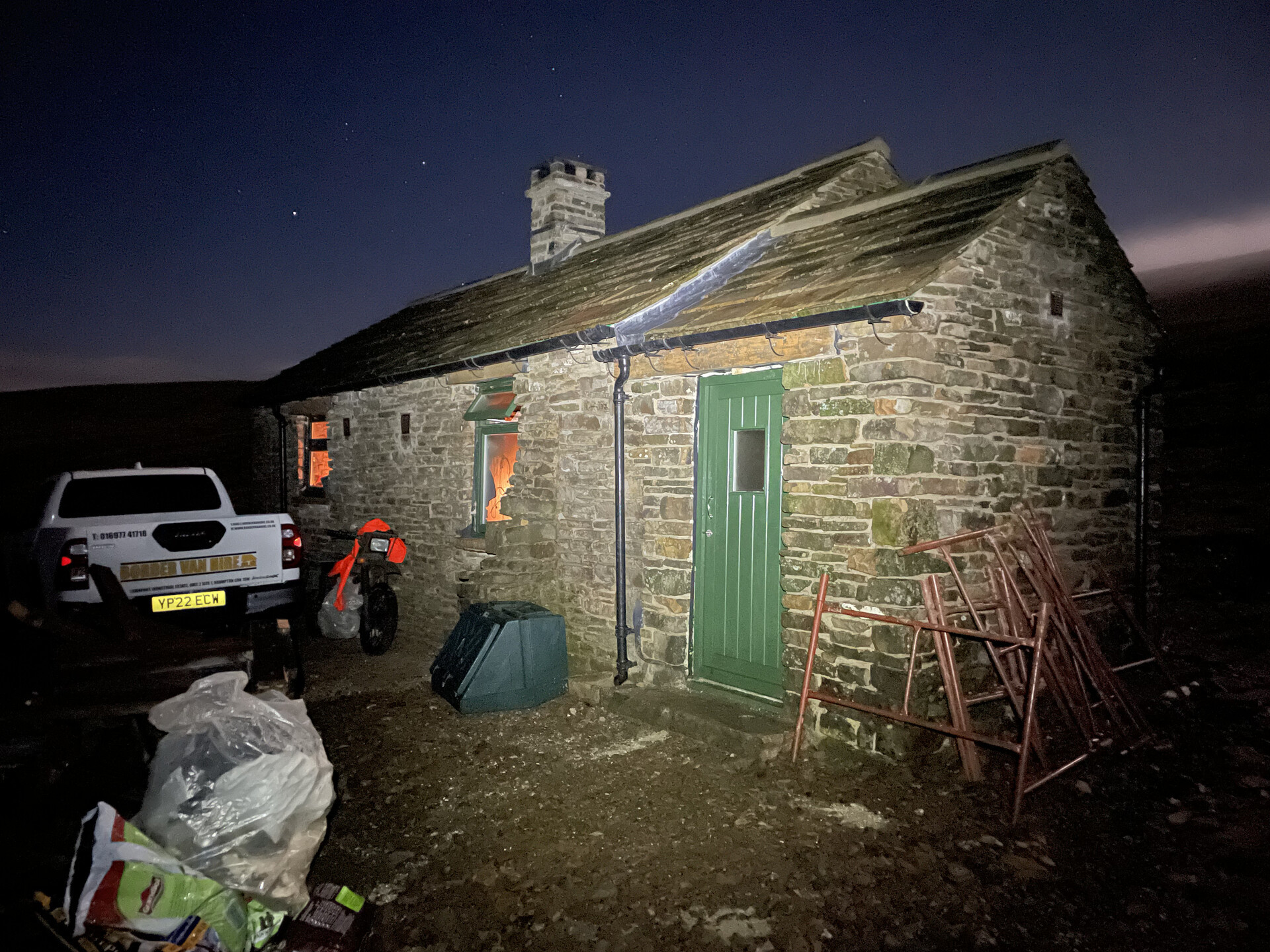 Greg's Hut from the outside, in the dark of night.