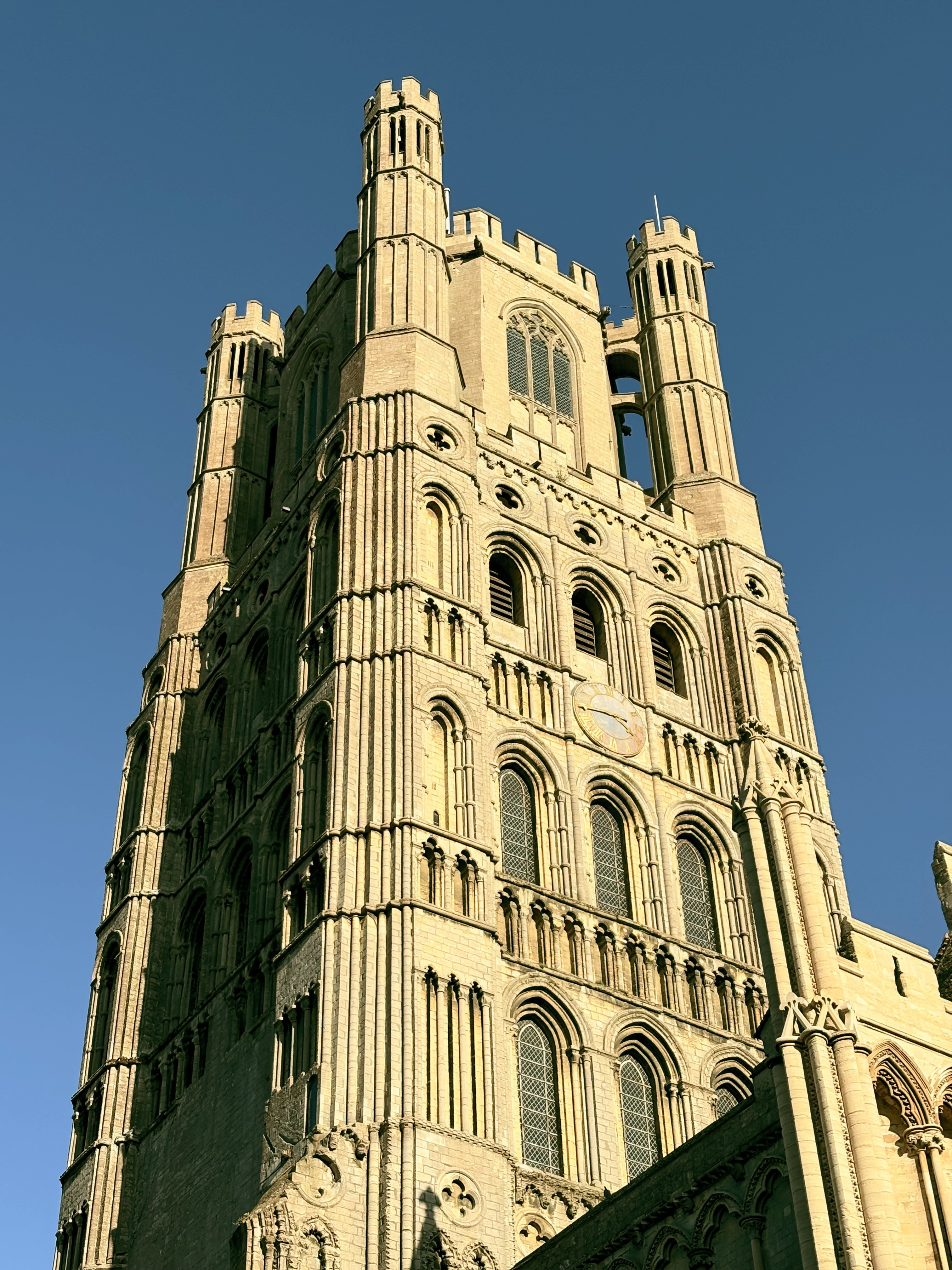 A view of the tower of gothic Ely cathedral in the late day sun