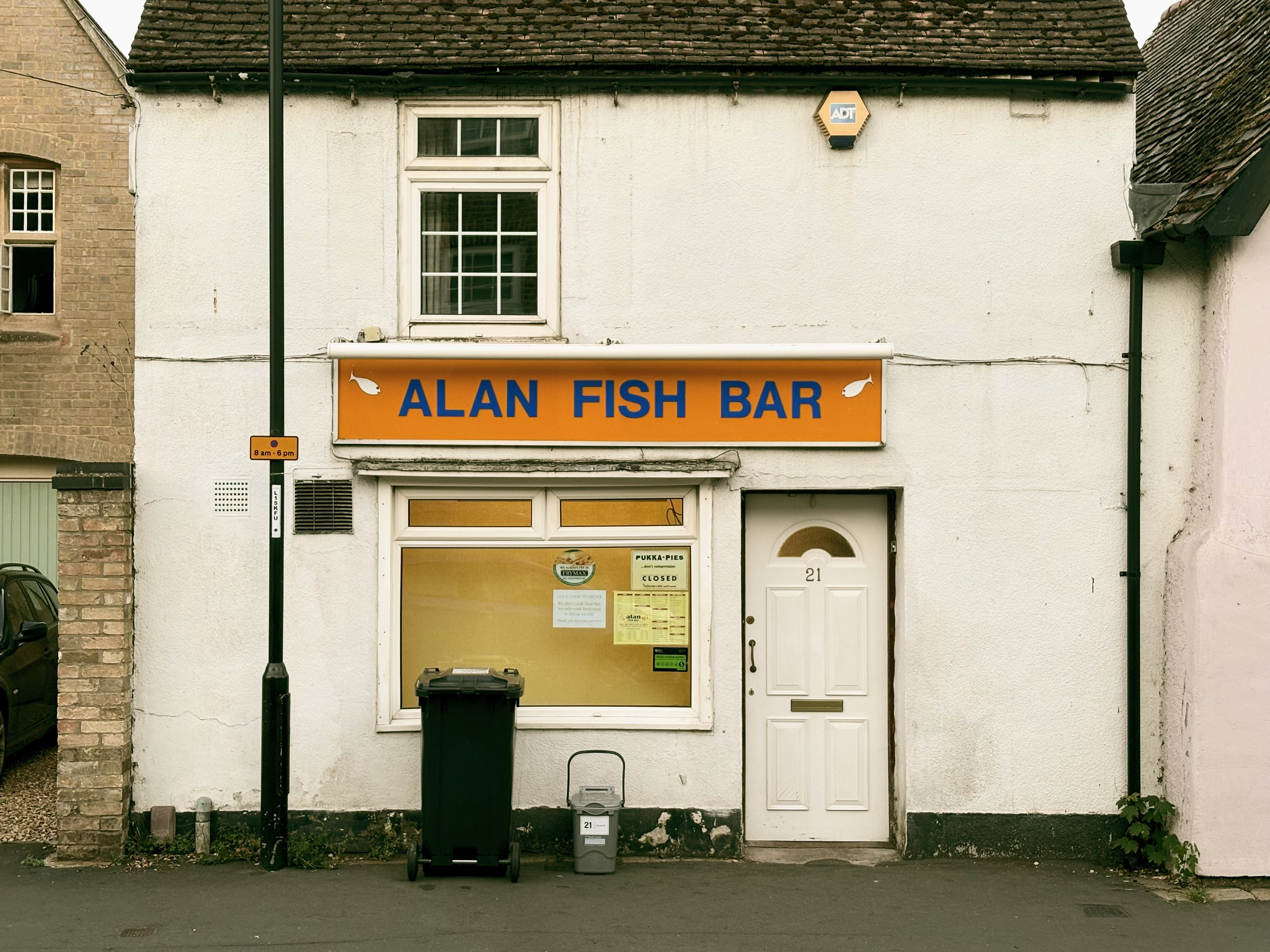 Alan’s fish bar, set in the ground floor of a 2+2 rendered terraced house.