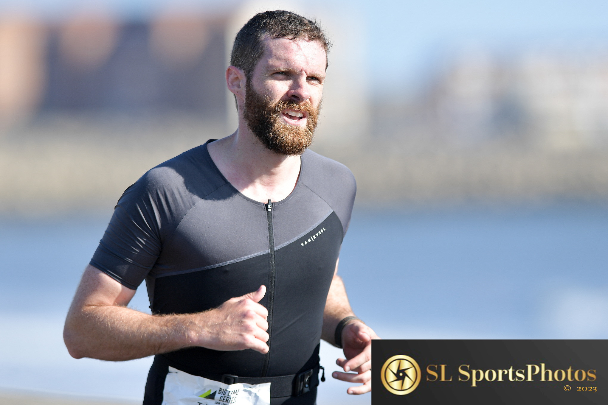 Mid-stride at the Big Lime triathlon, wearing a tight tri suit and an extremely pained expression