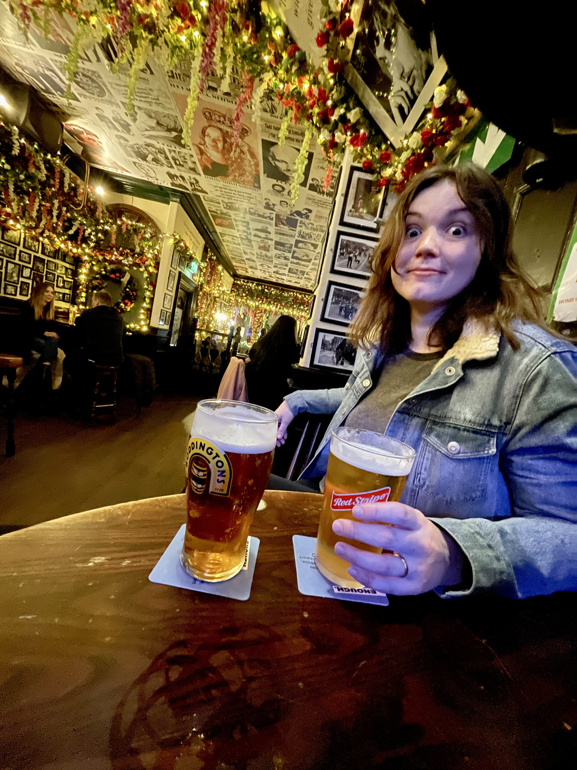 Drinking a pint of local Boddingtons at the pub in Manchester