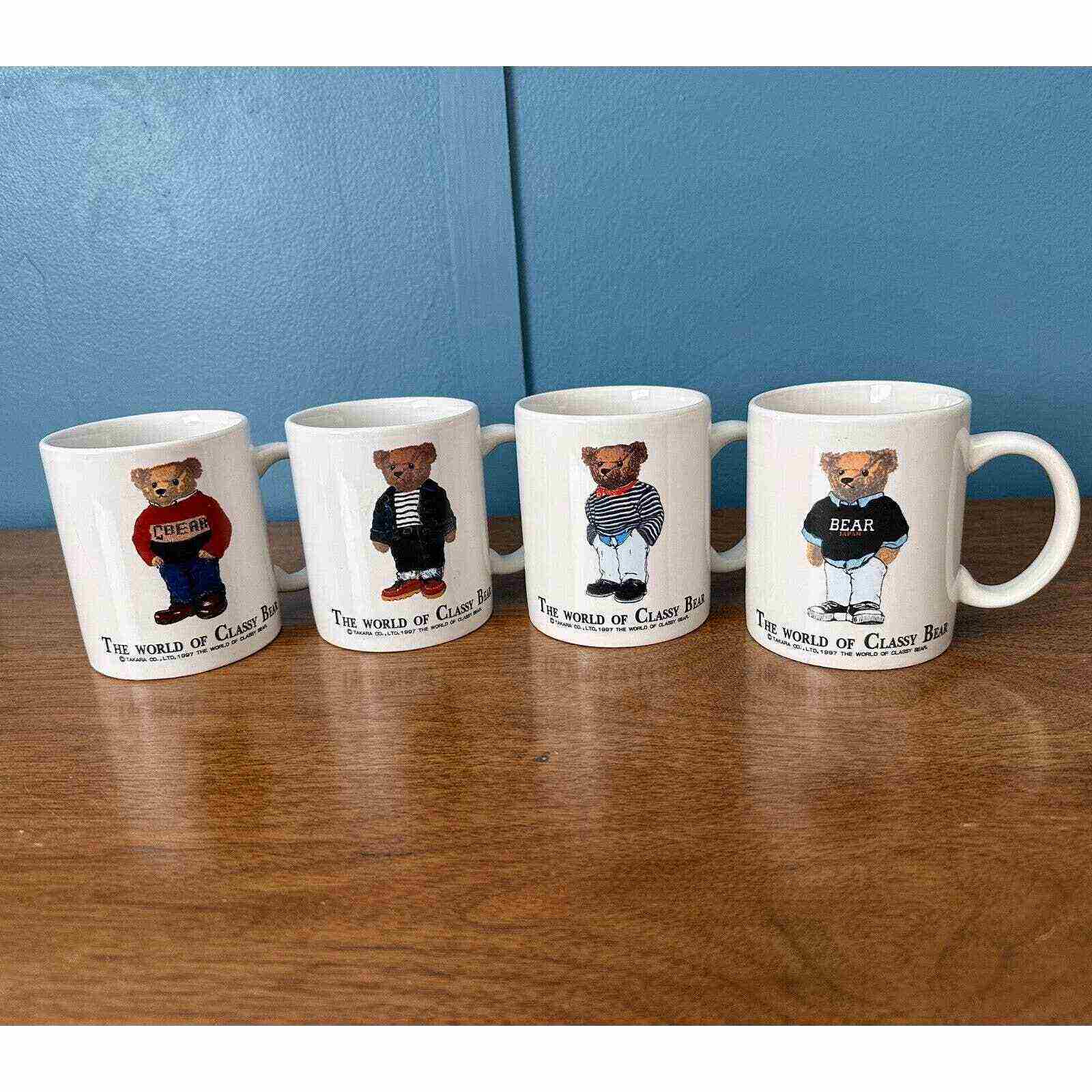 A set of four mugs with Classy Bear wearing different preppy outfits