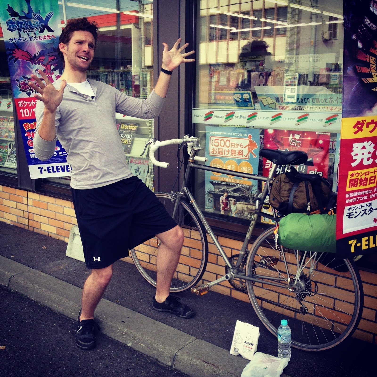 Me standing in front of my bike, itself leaning up against a combini, and I'm making some hand-wavey gesture and looking frivolous