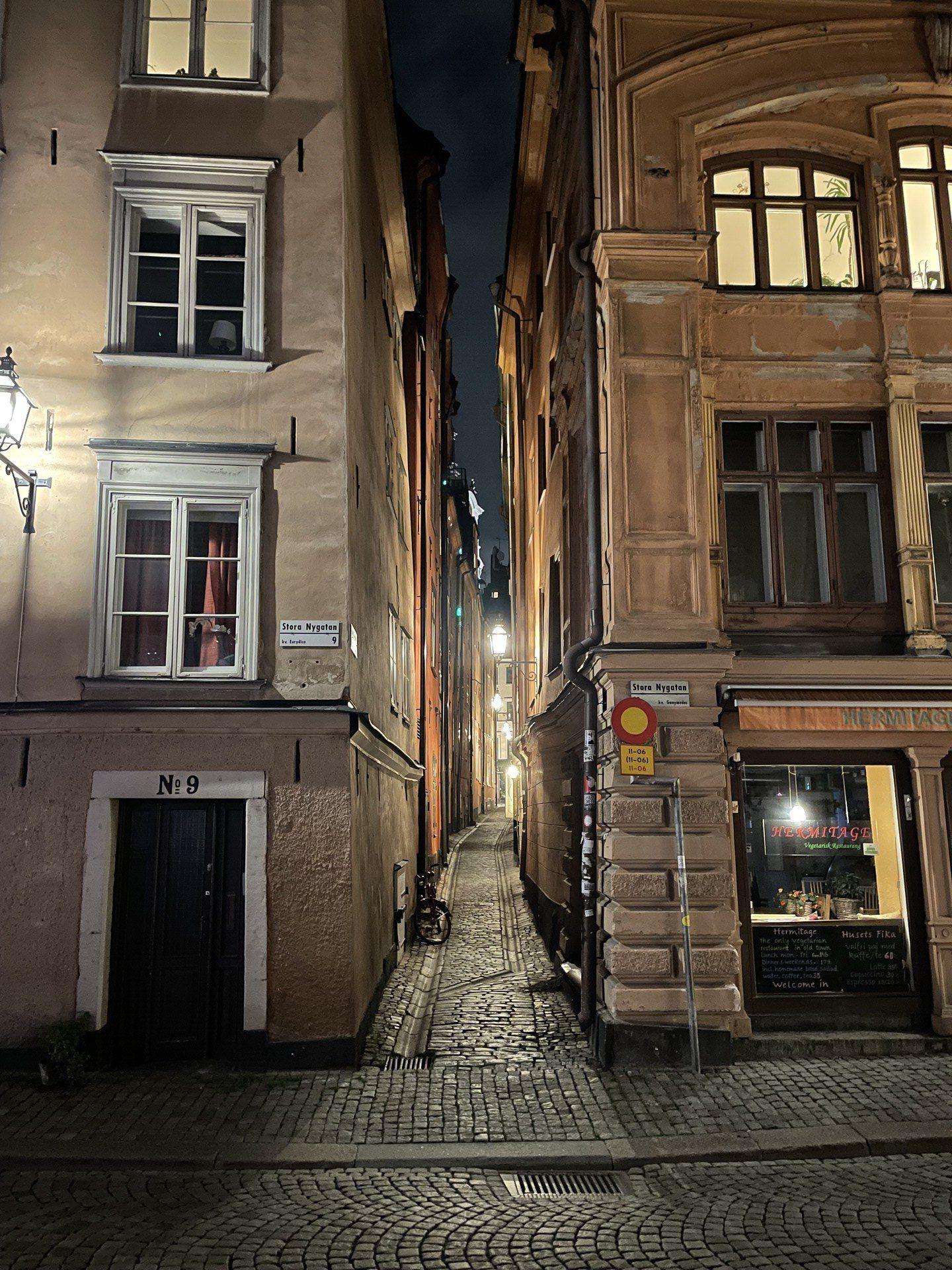 An alley in Gamla Stan, cobblestoned and narrow but tidy and well-lit.