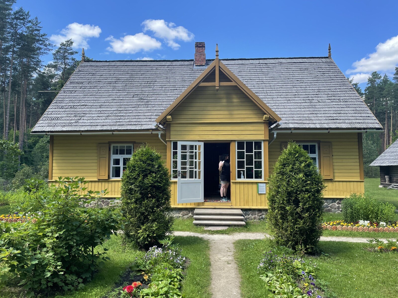 A yellow clapboard house at the Ethnographic Museum just outside Riga