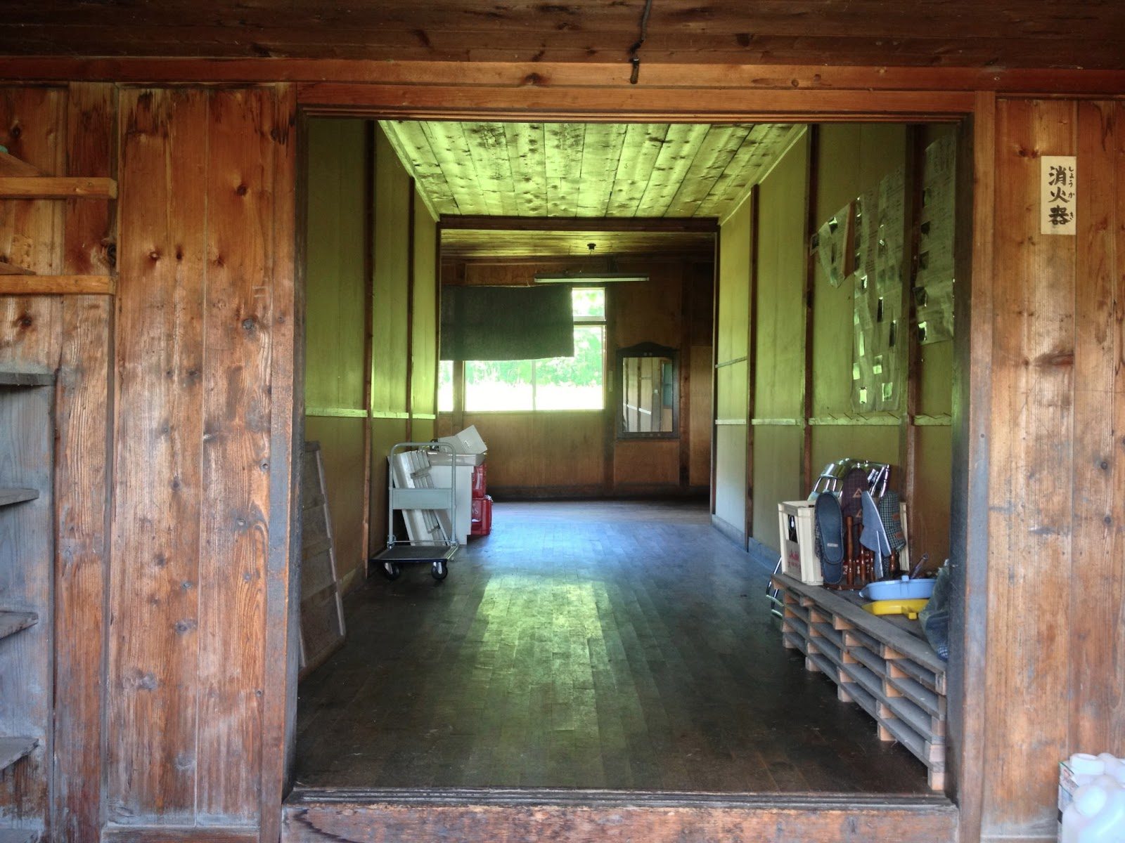 Looking in at the entrance way to the old school, everything made of old, dark wood