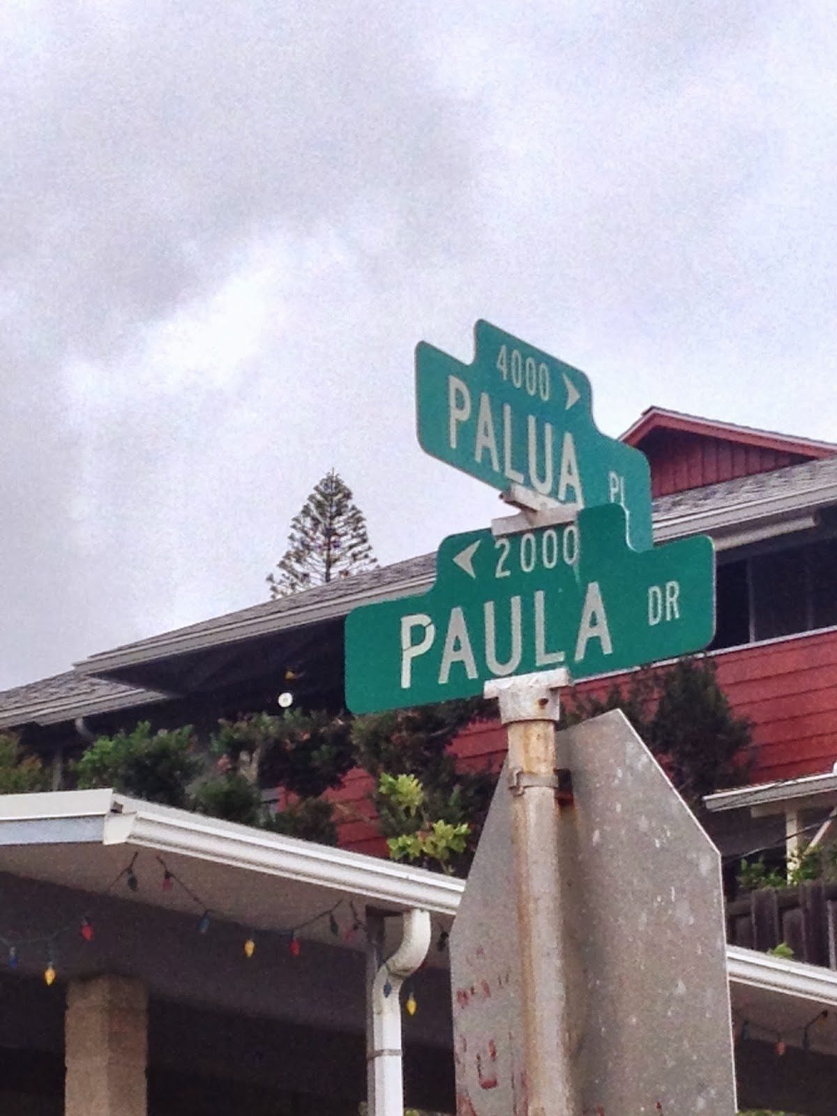 A road sign at an intersection, one sign reading