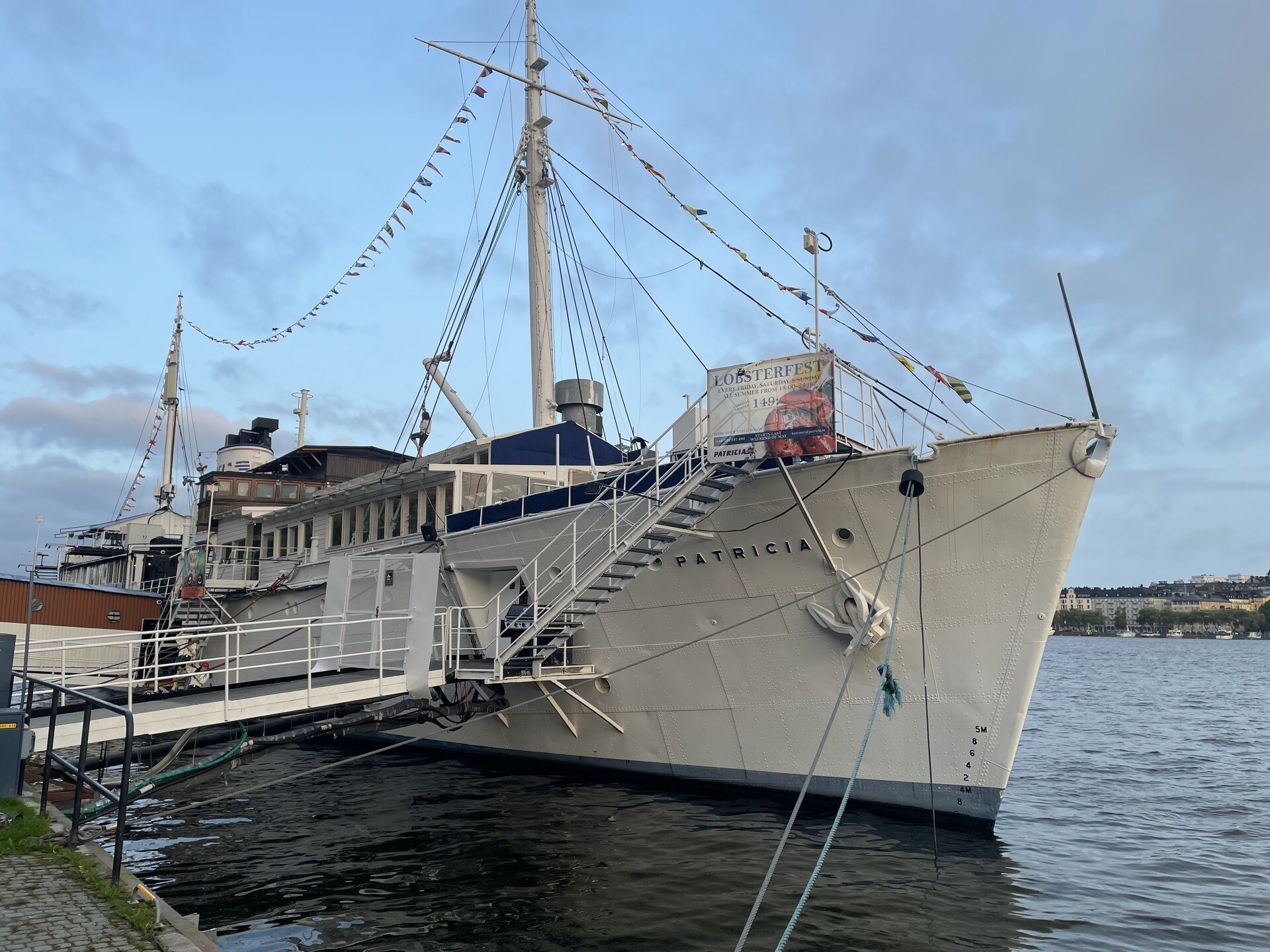 A ship called Patricia advertising a lobster bar at the onboard restaurant