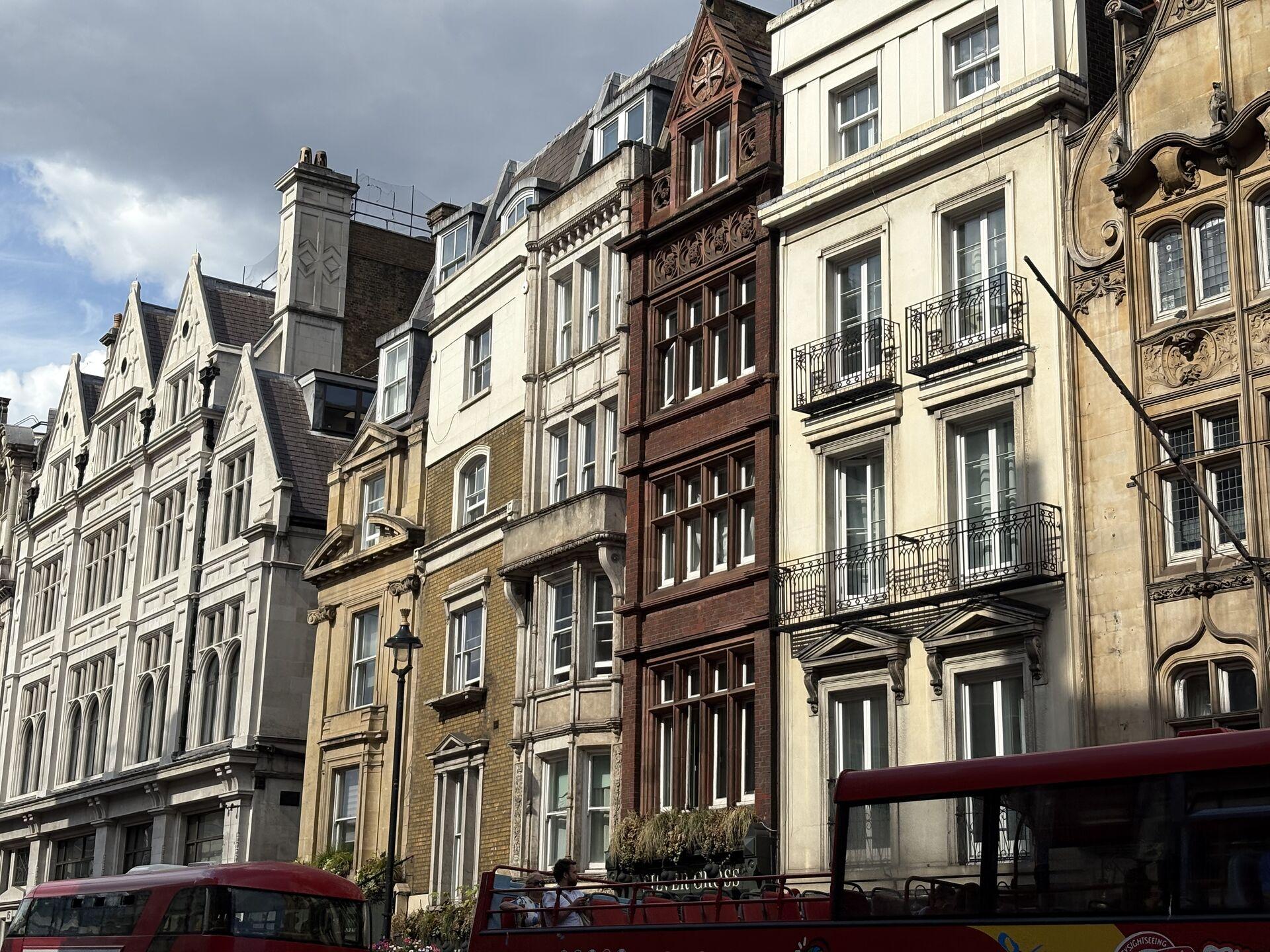 A row of typically London-looking buildings, all in different architectural styles but all extremely narrow
