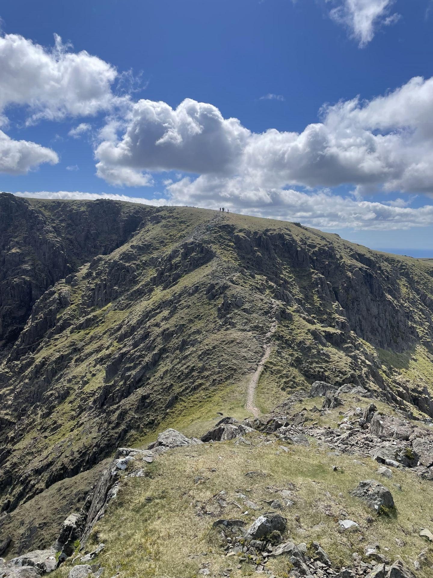 Looking back up a narrow path between rock crags leading up to the top of Scoat Fell