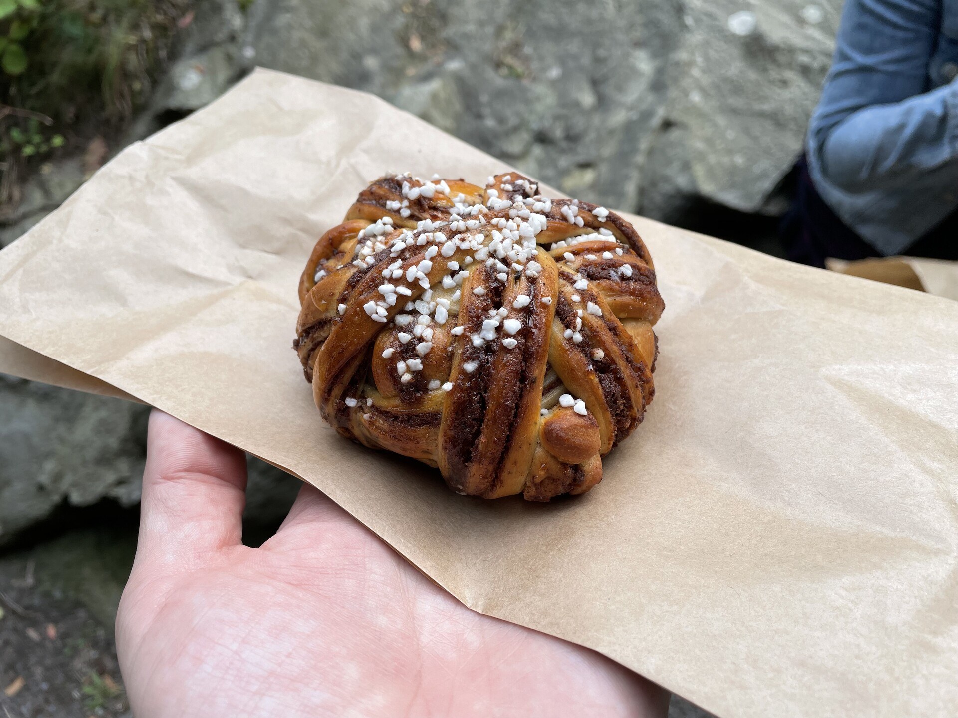 A Swedish-style cinnamon roll in the palm of my hand