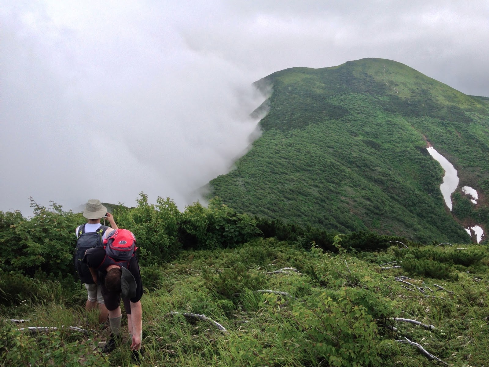 Looking down on clouds rolling over the shoulder of Teshio-dake