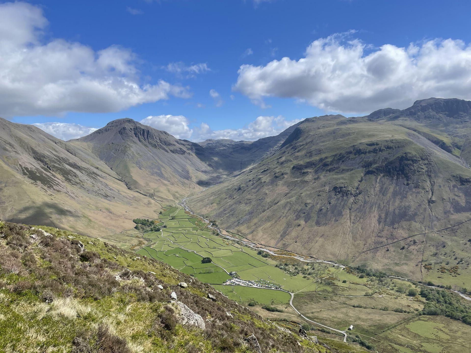 A view up Wasdale Head, with the famous stone walls splitting the fields and the hulks of Sca Fell, Great Gable, and Kirk Fell towering above