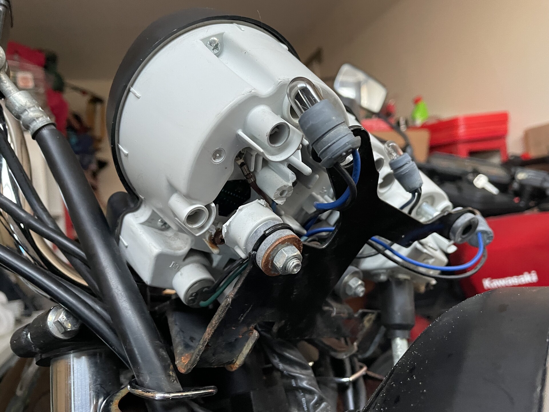 A bunch of wires coming out of the back of the instrument cluster on our Yamaha YBR.
