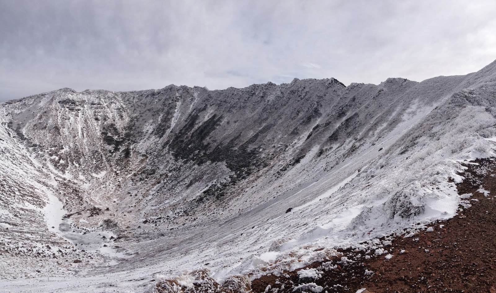 The crater of Yotei, dusted with a thin layer of snow and looking very dramatic