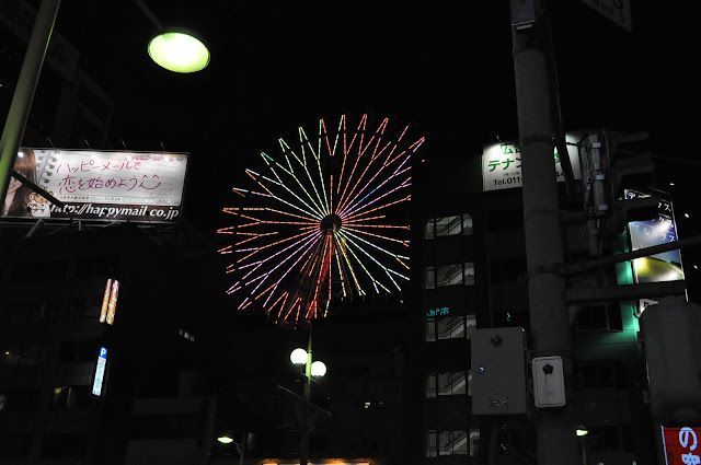 that billboard says "let's start loving by happy mail," which is a great idea