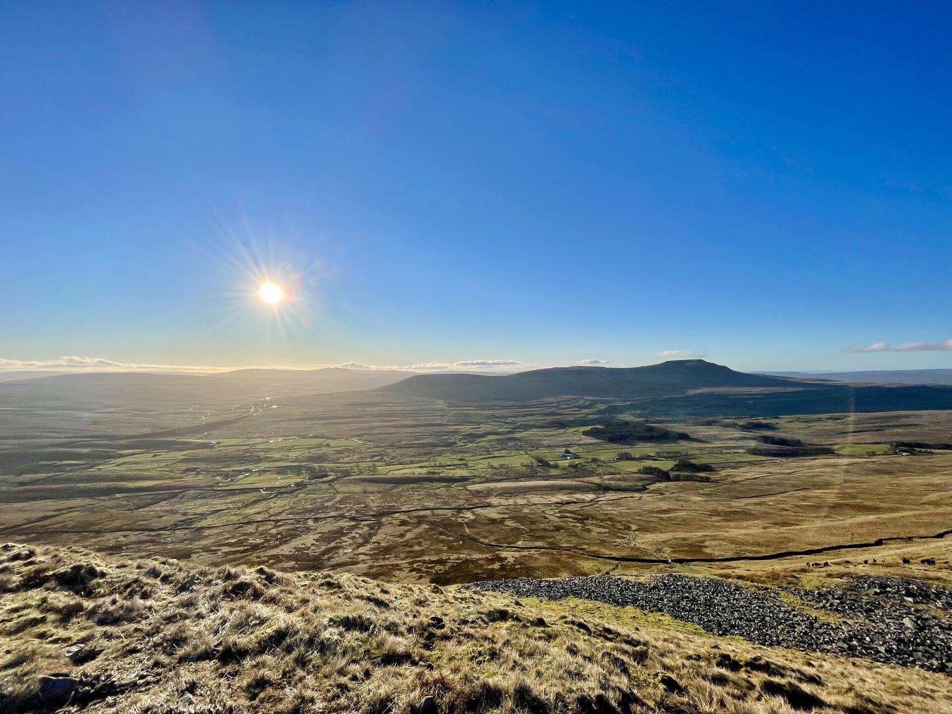 The view from Whernside: Ingleborough at centre right, Whernside behind at centre left, Ribblehead Viaduct at bottom right